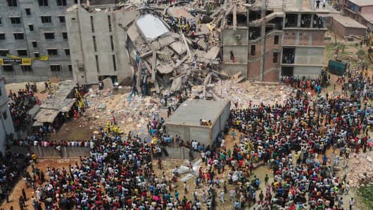 Rescuers at the scene after the Bangladesh building collapse in April.